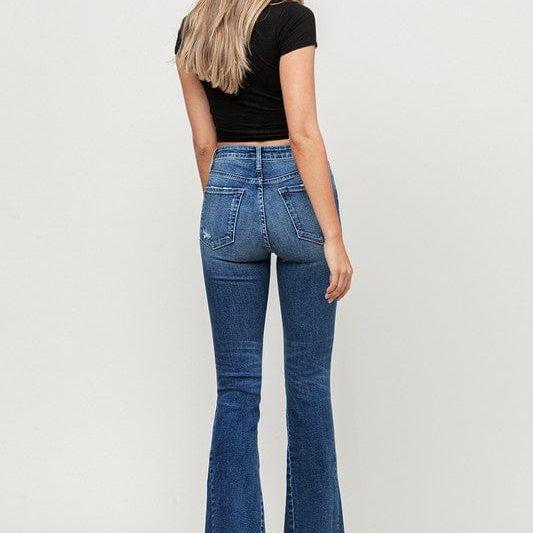 High rise distressed released hem flare